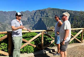 Sharing some information about the mountain peaks behind us and the village of Curral das Freiras.