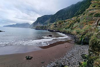 Black sand beach of Seixal and coast